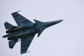 Russia says own fighter jet warned away U.S. spy plane over Black Sea