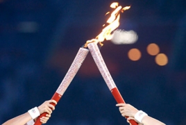 В эстафете олимпийского огня впервые принял участие робот