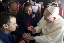 Pope Francis marries two flight attendants on papal plane