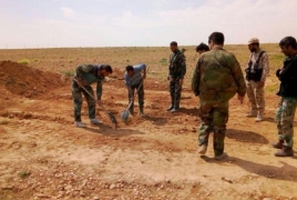 Syrian troops discover two mass graves in east Hama
