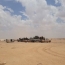 Syrian troops meet up with Iraqi forces in newly liberated area