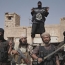 Islamic State suffers symbolic defeat along Syrian-Iraq border
