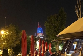 Skyscraper in Azerbaijan lit in colors of Armenian flag