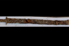 Eight-year-old girl draws ancient pre-Viking-era sword from lake