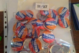 18-year-old citizens receive souvenir badges after voting