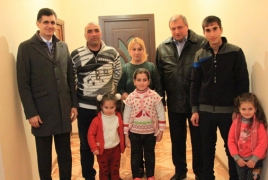 Family in rural Armenia celebrates long-awaited housewarming