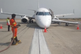 Myanmar pilot lands plane without front wheels