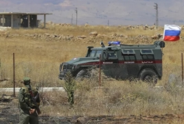 Russian troops patrol between Turkish and Syrian forces in Manbij