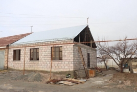 Family gets decent home after 12 years of living in metal container