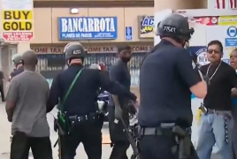 LA police detain group defending store, while would-be burglars flee