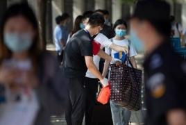 China to test all of Wuhan’s 11 million residents amid new Covid cases