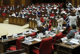 Armenia lawmakers brawl in parliament, throw bottles at each other