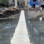 Armenia: Rescue workers restore pedestrian bridge for flood-hit community