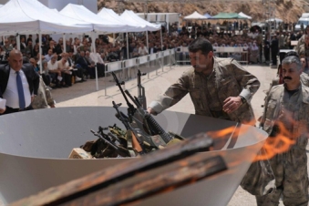 PKK militants burn weapons in symbolic Iraq ceremony