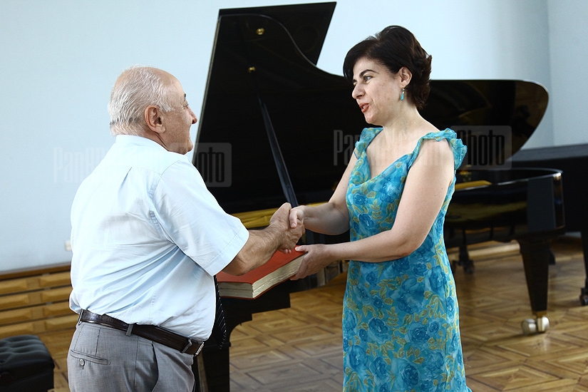 RA Deputy Minister of Diaspora Samvel Petrosyan hands on the score of Chipolino ballet to Aram Khachaturyan museum