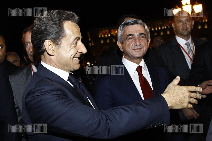 French president Nicolas Sarkozy walks through Republic Square