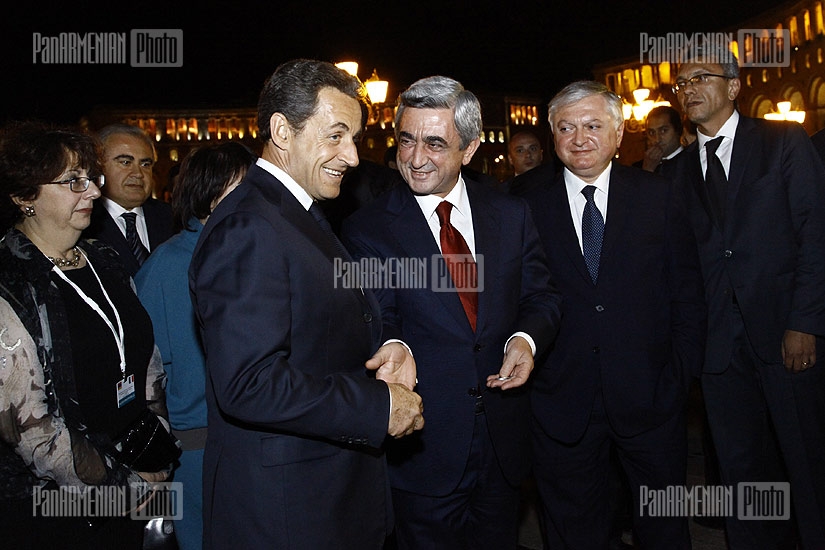 French president Nicolas Sarkozy walks through Republic Square