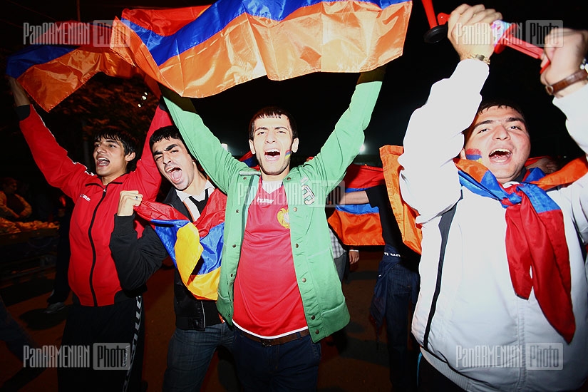 Fans celebrating Armenia's victory at Armenia-FYROM Euro-2012 qualifier match