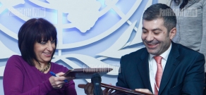 Executive director of Armenian National Competitiveness Foundation Arman Khachatryan and UN resident coordinator Dafina Gercheva sign a memorandum