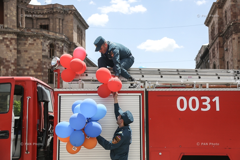 Festive parade of fire fighters and rescuers entitled 'May 911' in Republic Square