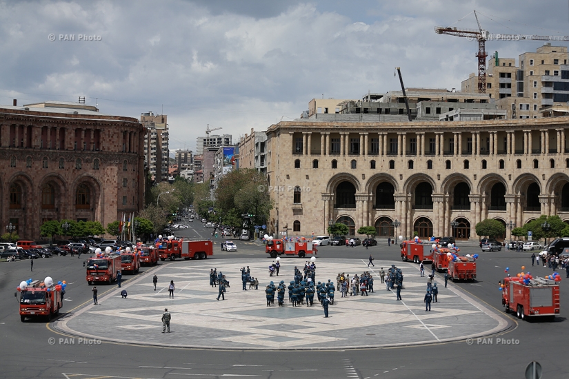 Festive parade of fire fighters and rescuers entitled 'May 911' in Republic Square