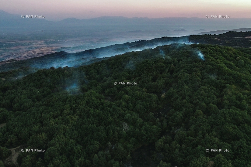 Fire rages in the vegetated area near the Armenian village of Byurakan