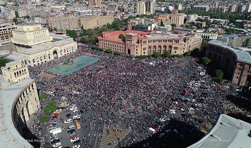 The Armenian citizens watching a special parliament sitting on the election of new Prime Minister