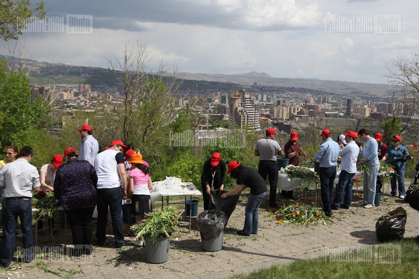 Processing of flowers laid at Genocide Memorial 