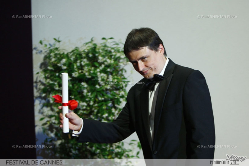 Romanian director Cristian Mungiu after being awarded with the Best Screenplay award for his film 