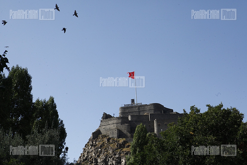 Turkish flag rising over Kars fortress, founded by Armenian royal family of Bagratuni