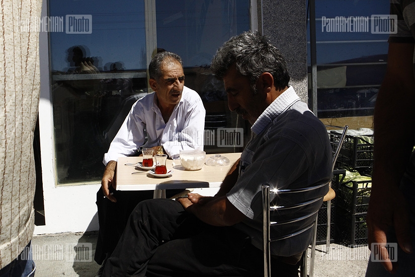 Typical picture for the region: men in a tea house with short, narrow tea cups 