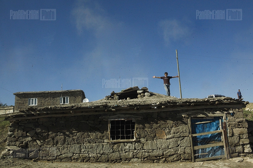 A boy on the roof of a Kurdish village in Mush valley. Conversations about ethnicity were prohibited some ten years ago. Currently people proudly speak about their Kurdish and even Armenian origins