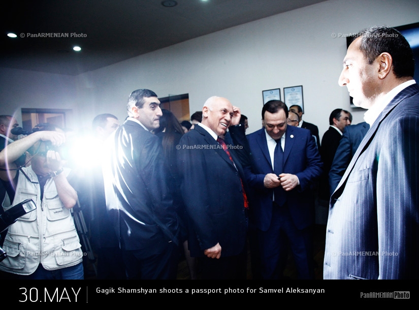Gagik Shamshyan shoots a passport photo for MP Samvel Aleksanyan