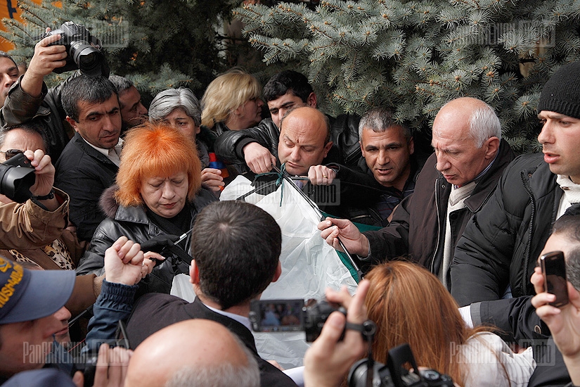 Raffi Hovannisian's supporters try to put up a tent in Freedom Square