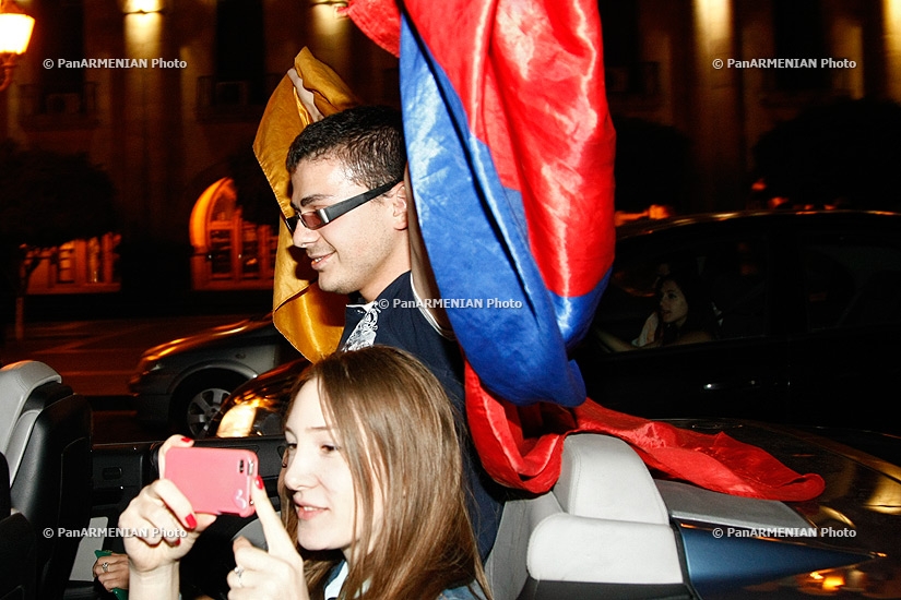 Armenian fans celebrate their team's victory over Czech Republic