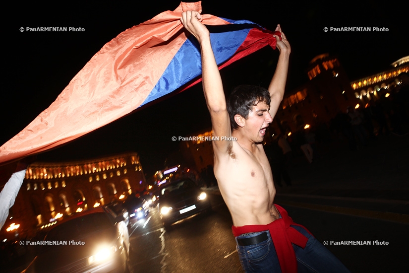Armenian fans celebrate their team's victory over Bulgaria
