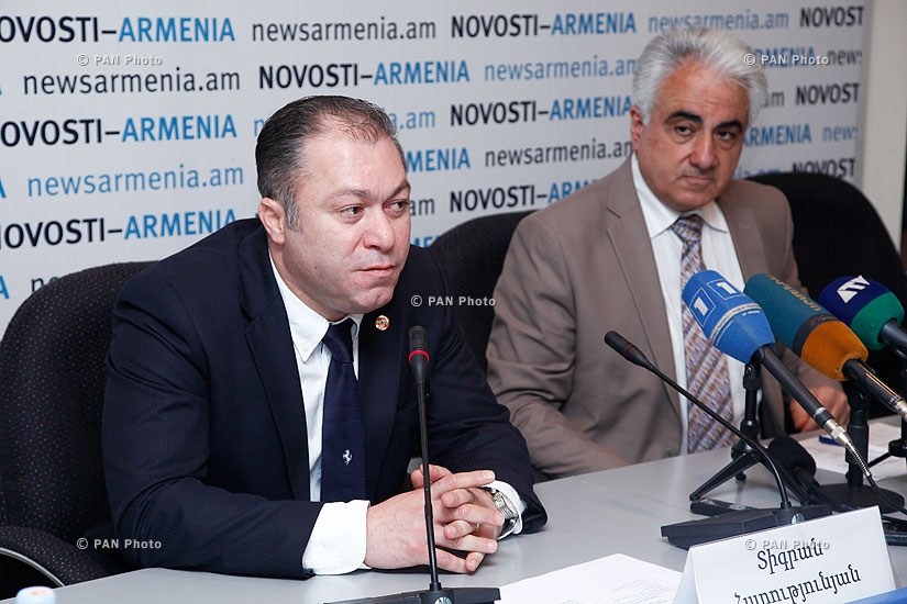 AJA vice president Artak Udumyan and Deputy Minister of economy Tigran Harutyunyan sign an agreement and give press conference