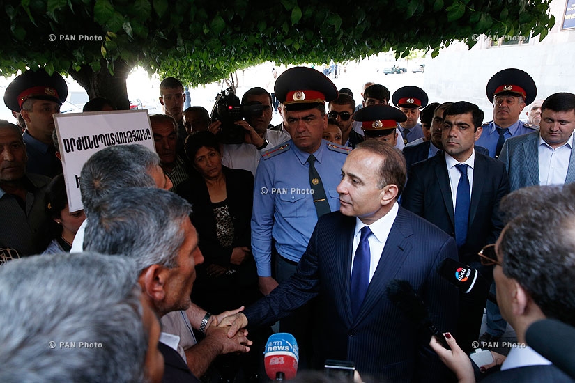 Prime minister Hovik Abrahamyan meets with demonstrators in front of RA Government
