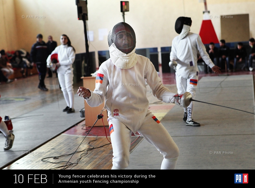Young fencer celebrates his victory during the Armenian youth fencing championship. Yerevan, Armenia