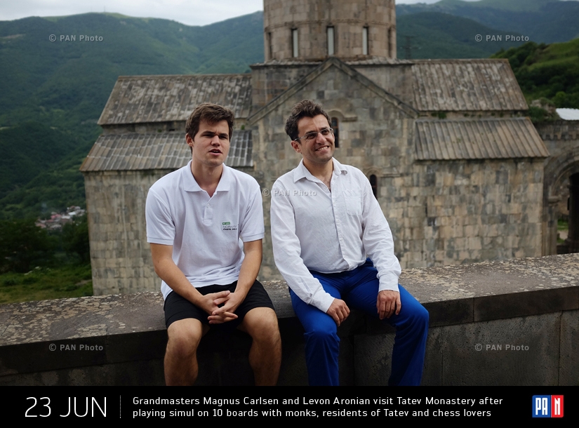 Grandmasters Magnus Carlsen and Levon Aronian visit Tatev Monastery after playing simul on 10 boards with monks, residents of Tatev and chess lovers. Tatev Village, Syunik Province, Armenia
