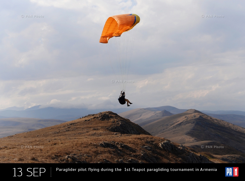 Paraglider pilot flying during the 1st Teapot paragliding tournament in Sevan, Armenia