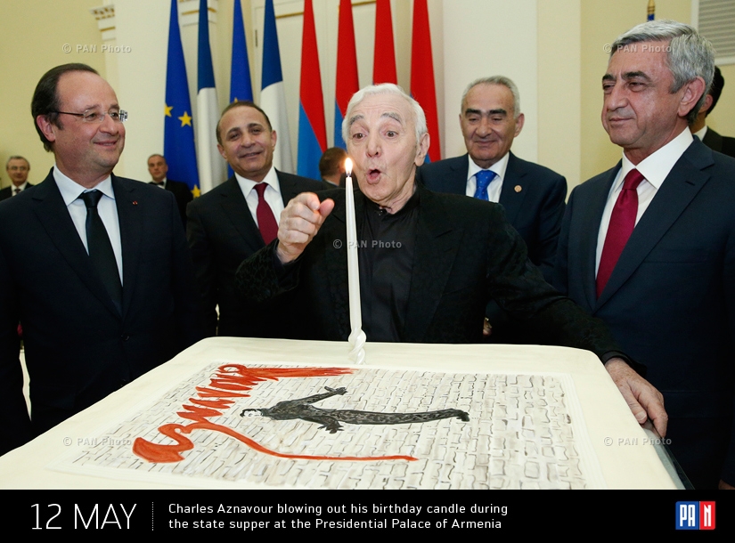 Charles Aznavour blowing out his birthday candle during the state supper at the Presidential Palace of Armenia. Yerevan, Armenia