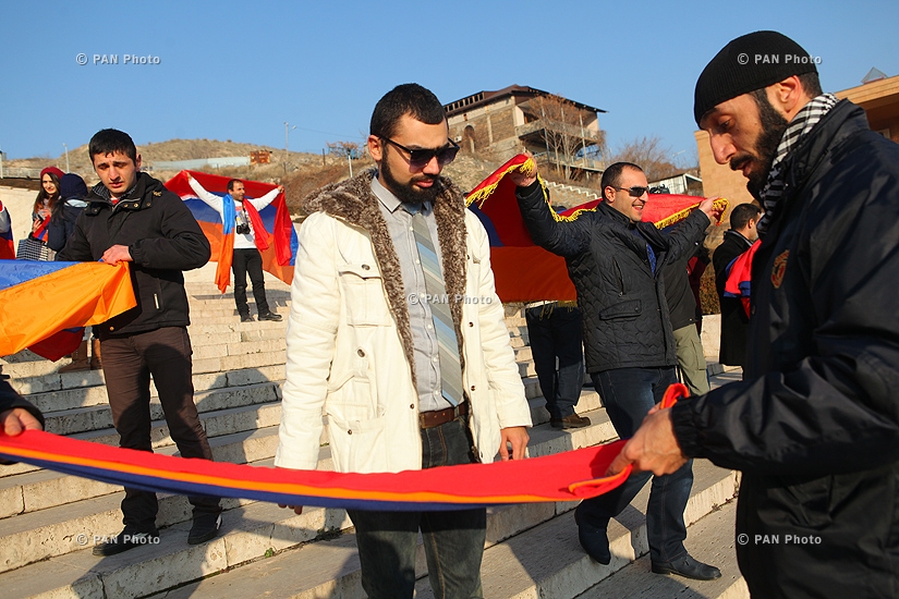 Activists take photos with Armenian flag to protest filming ban at Cascade
