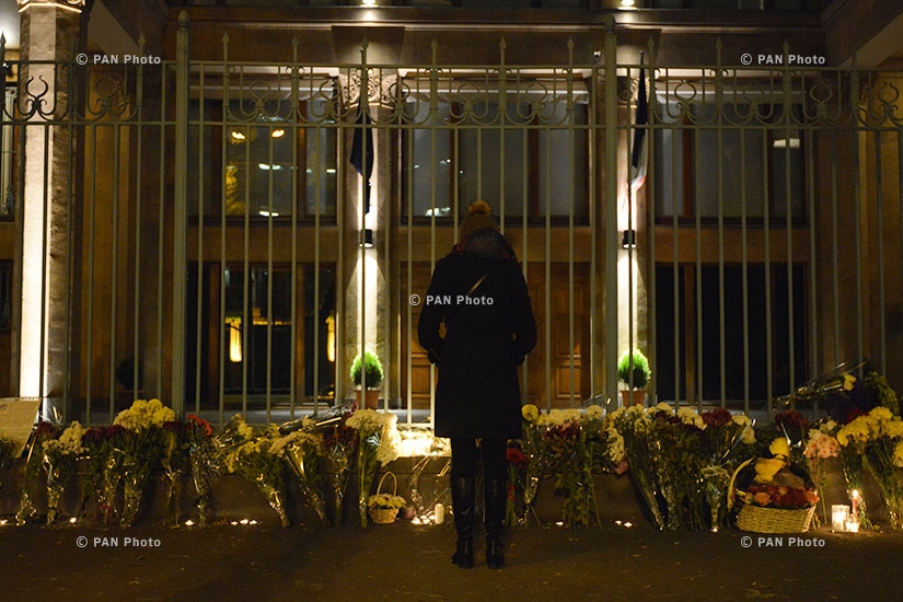 People put flowers in front of French Embassy in Armenia in honor to the victims of terrorist attack in Paris