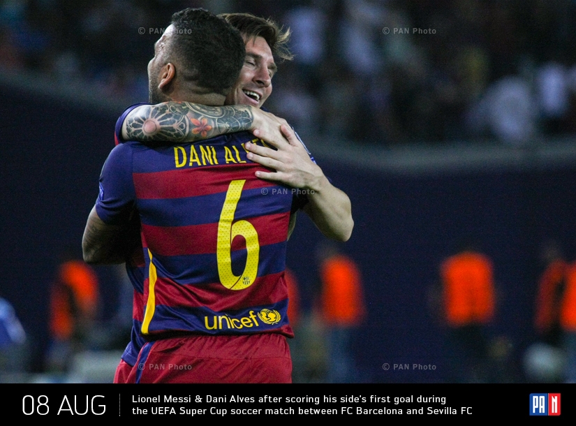  Barcelona's Lionel Messi, left, hugs teammate Dani Alves after scoring his side’s first goal during the UEFA Super Cup soccer match between FC Barcelona and Sevilla FC at the Boris Paichadze Dinamo Arena stadium, in Tbilisi, Georgia