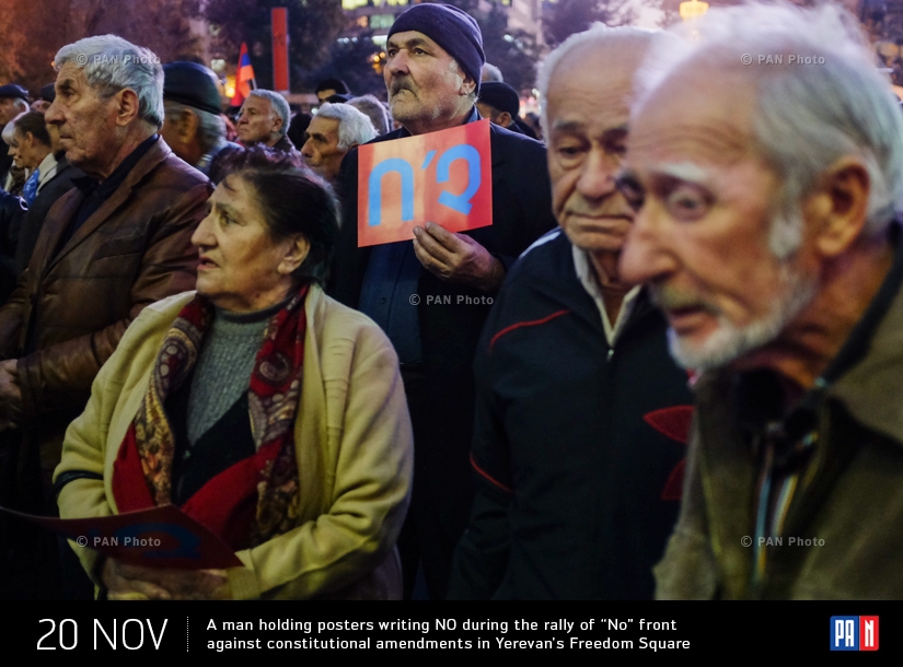 A man holding poster writing ‘NO’ during the rally of ‘No’ front against constitutional amendments in Yerevan's Freedom Square