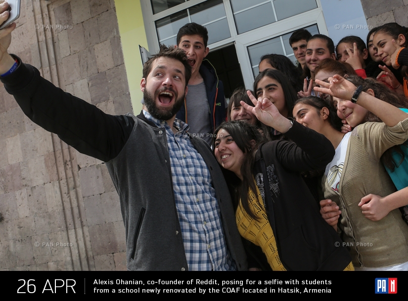 Armenian-American internet entrepreneur Alexis Ohanian, co-founder of social website Reddit, posing for a selfie with students from a school newly renovated by the Children of Armenia Fund (COAF) located in Hatsik, Armenia. Ohanian visited the COAF-suppor