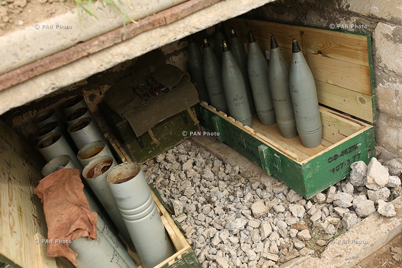 A projectile and cartridge cases of a D-30 howitzer in the southeastern section of the Nagorno Karabakh-Azerbaijan contact line
