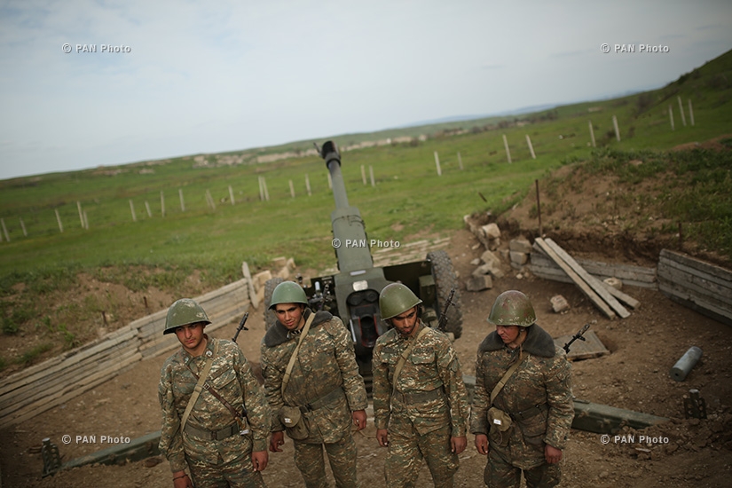 First artillery brigade standing near a D-30 howitzer in the southeastern section of the Nagorno Karabakh-Azerbaijan contact line