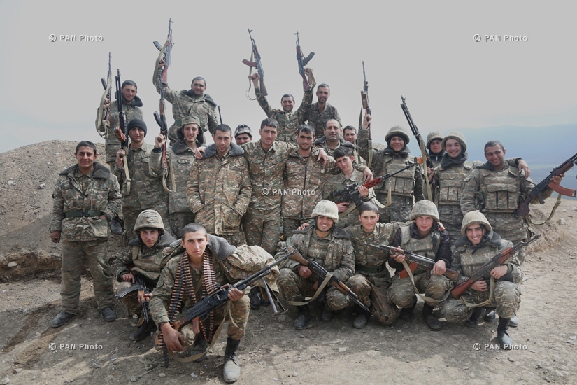 Armenian soldiers pose near a frontline in Nagorno-Karabakh Republic